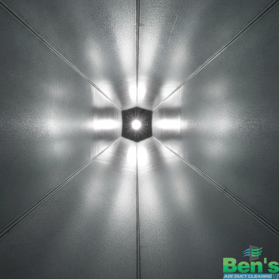 The inside of an air duct after professional cleaning — bare, clean galvanized steel