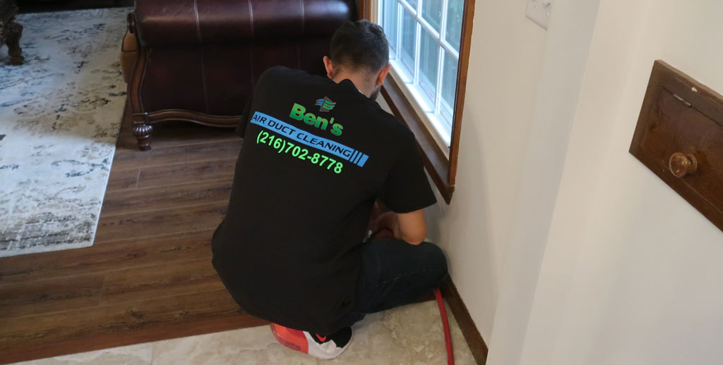 Technician Cleaning Air Vent